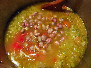 Pot of Soup with Beans and Tomatoes on Top