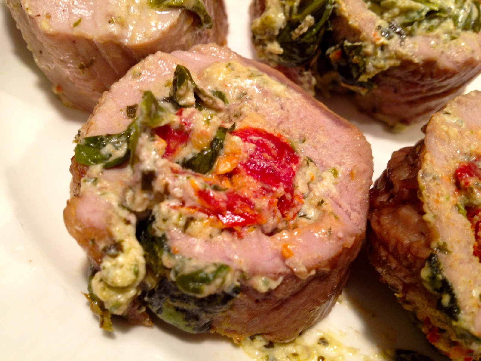 pork tenderloin stuffed with spinach sun dried tomatoes and goat cheese
