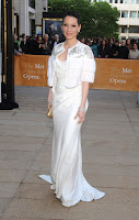 Lucy Liu wearing a white floor lenght dress