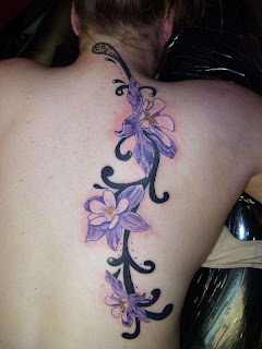Custom Flower on Tribal Vine Tattoo