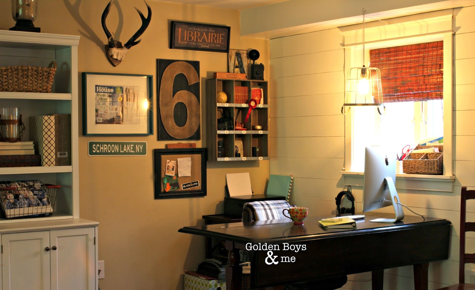 Home office in corner of family room with gallery wall and wire basket pendant light-www.goldenboysandme.com