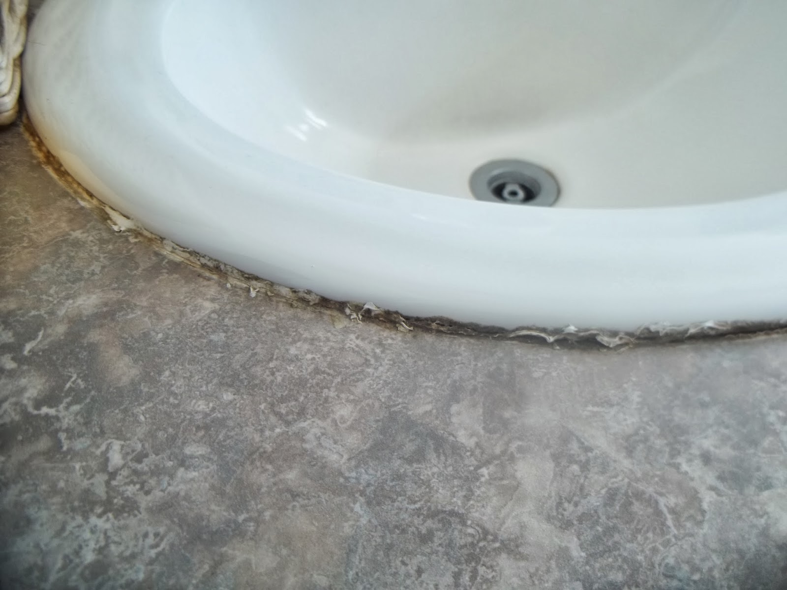 Bathroom Sink Caulk. Now With The Old Caulk Removed And The Battle ...