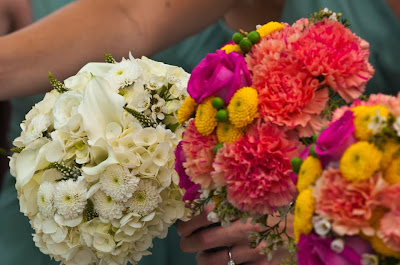 White bridal bouquet and tangerine, pink and yellow bridesmaids bouquets mokarafloral.com