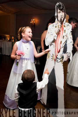 Flower girl and ringbearer dancing with cardboard Elvis at the wedding reception