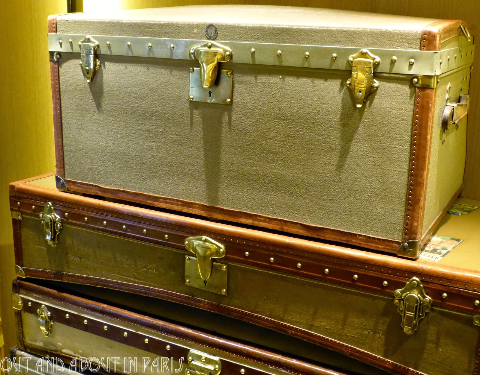 Moynat shopping for luxury handbags, travel trunks and champagne