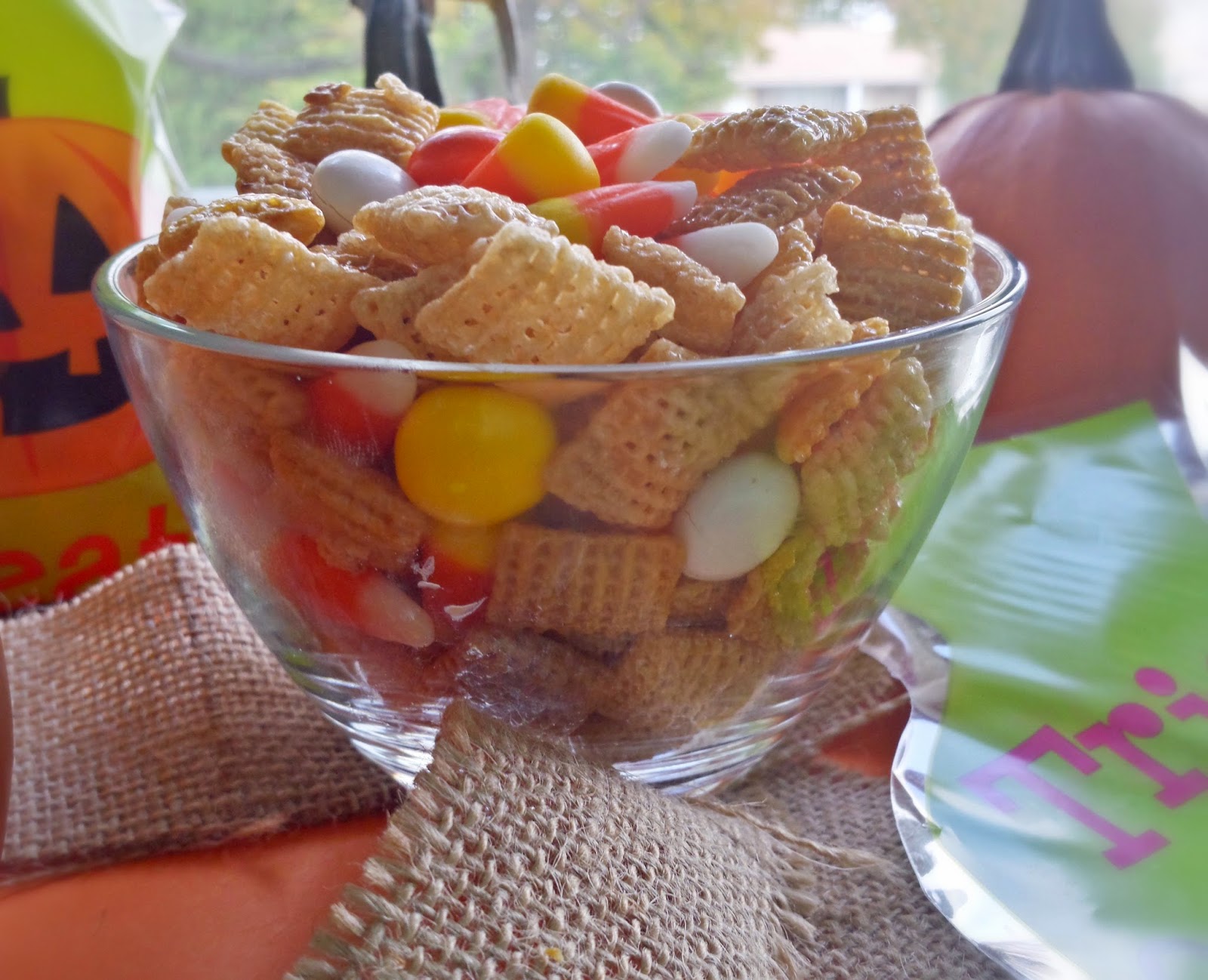 a bowl of candy corn chex mix