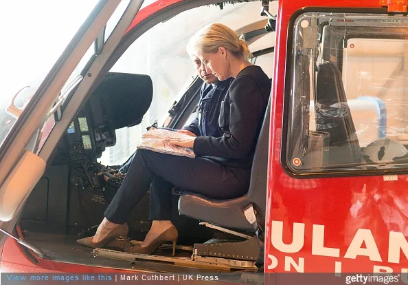  Sophie, Countess of Wessex speaks to pilot Dave Webber in the cockpit of an Air Ambulance during a visit to officially open the new air operating base at Thames Valley Air at RAF Benson