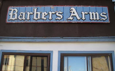 Sign reading Barbers Arms