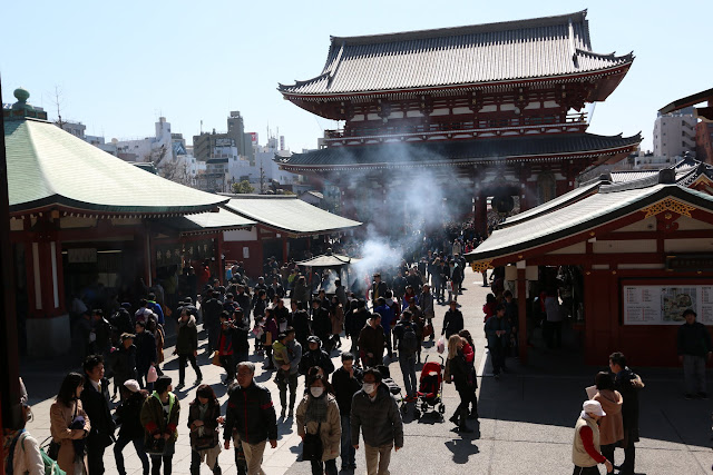 It's getting crowded with Japanese and the visitors at the main temple's hall of Asakusa Sensoji Temple in Tokyo, Japan It's getting crowded with Japanese and the visitors at the main temple's hall of Asakusa Sensoji Temple in Tokyo, Japan