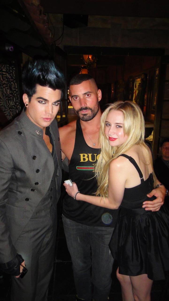 Adam Lambert poses with A lessa...