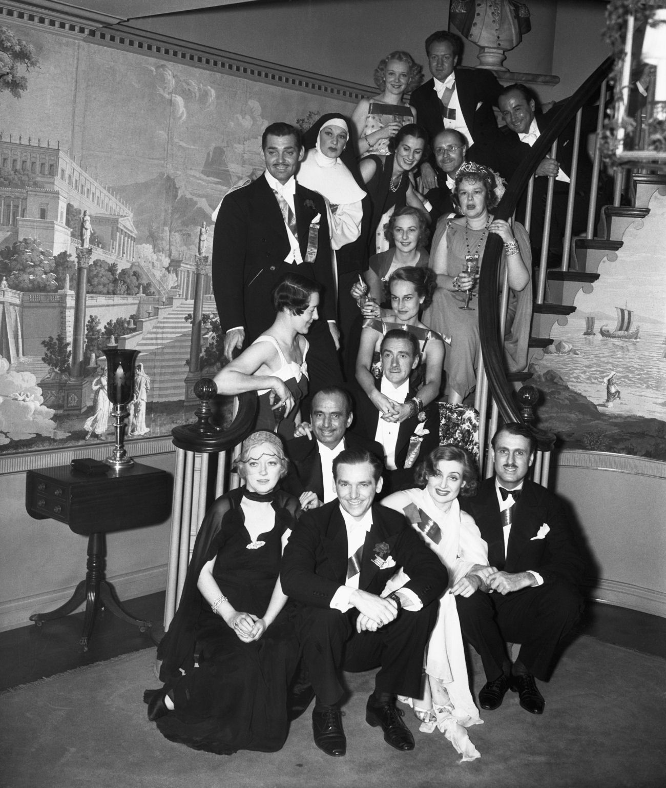 Clifton Webb at home with friends, including Clark Gable