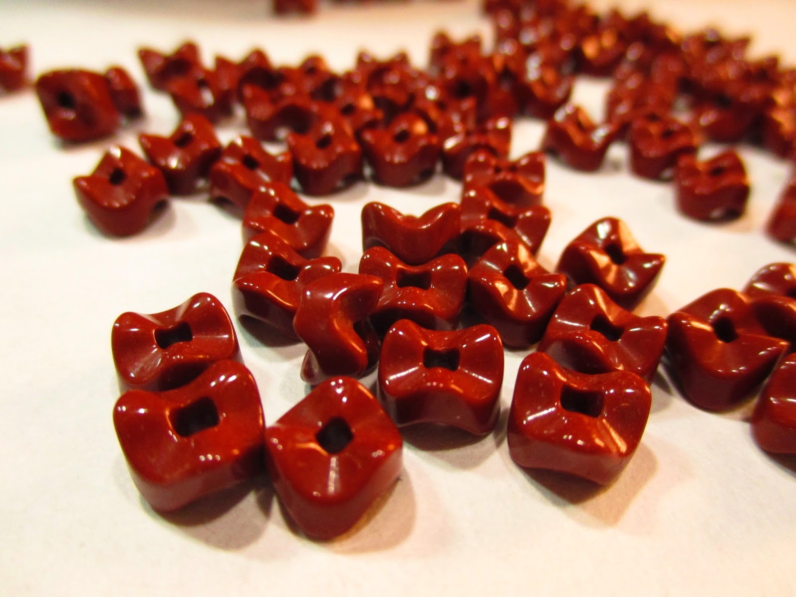 Rust brown glass vertebrae beads.