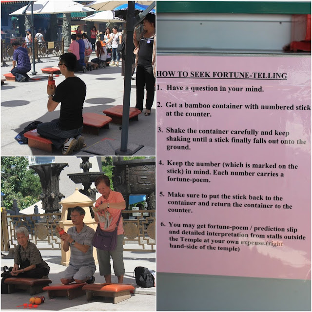 Practicing Kau Cim by shaking the container with fortune sticks with your question in your mind to kau cim at Wong Tai Sin Temple in Kowloon, Hong Kong Practicing Kau Cim by shaking the container with fortune sticks with your question in your mind to kau cim at Wong Tai Sin Temple in Kowloon, Hong Kong