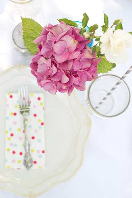 Pink hydrangeas, polka dot napkins, and paper straws!  Such a cute and simple tablescape!