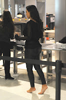 Kim Kardashian barefoot at Miami Airport 
