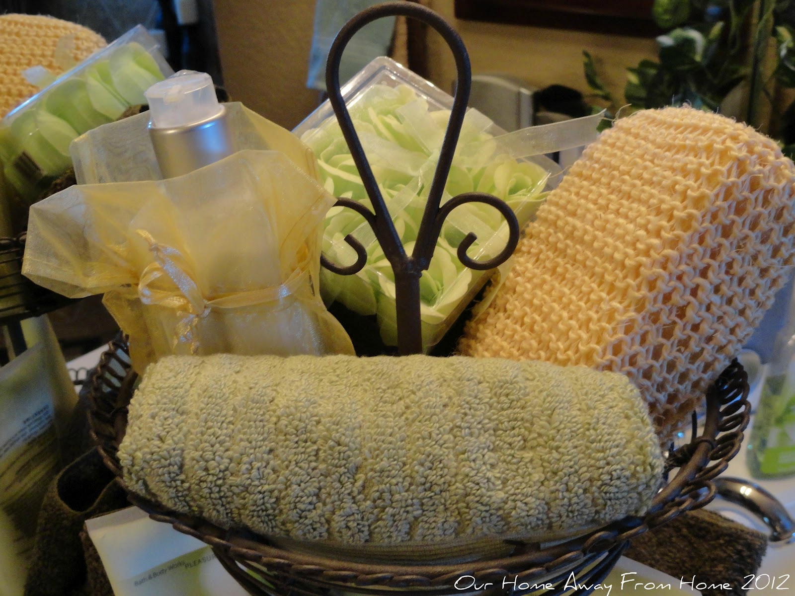 Our Home Away From Home Tiered basket in the bathroom and glass jars