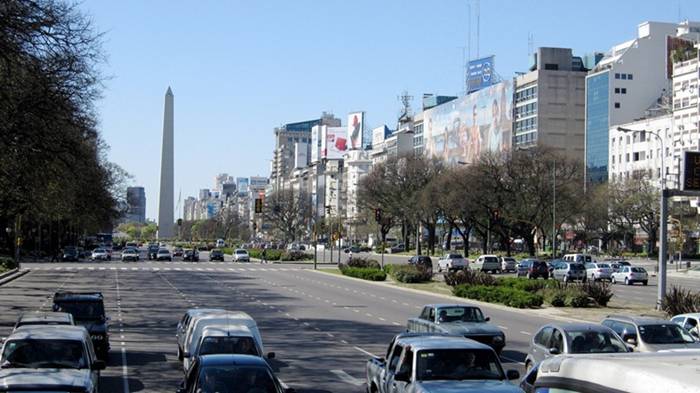 9 de Julio Avenue (or Avenida 9 de Julio, in the local tongue) in downtown Buenos Aires, Argentina, is not just any street. Nine lanes wide, with gardened medians between the opposing flow of traffic, this is the widest street in the world. Only those with a quick pace and long legs will be lucky to get to the other side before the traffic lights at the intersection changes. A pedestrian crossing this street usually requires a few extra minutes and two to three traffic light rotations. 9 de Julio Avenue is only 1 km long but 110 meters wide.