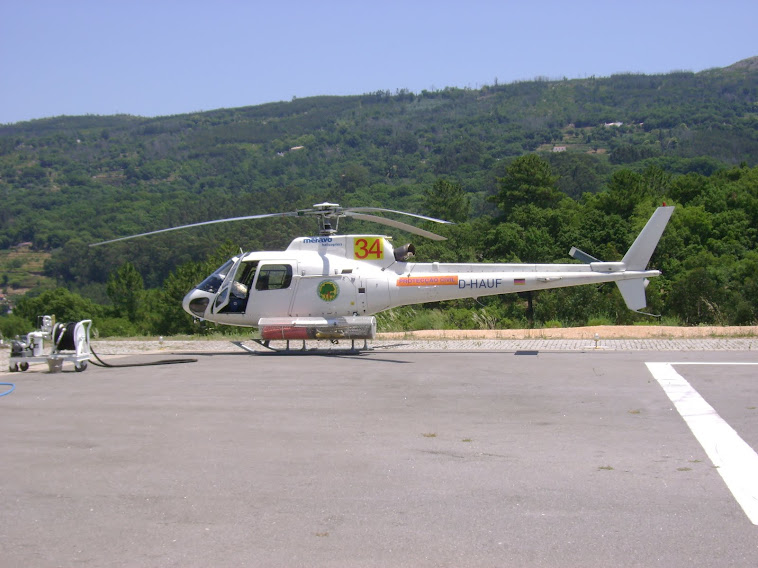 HELIPORTO E UM DOS HELICÓPTEROS EM SERVIÇO AOS INCÊNDIOS