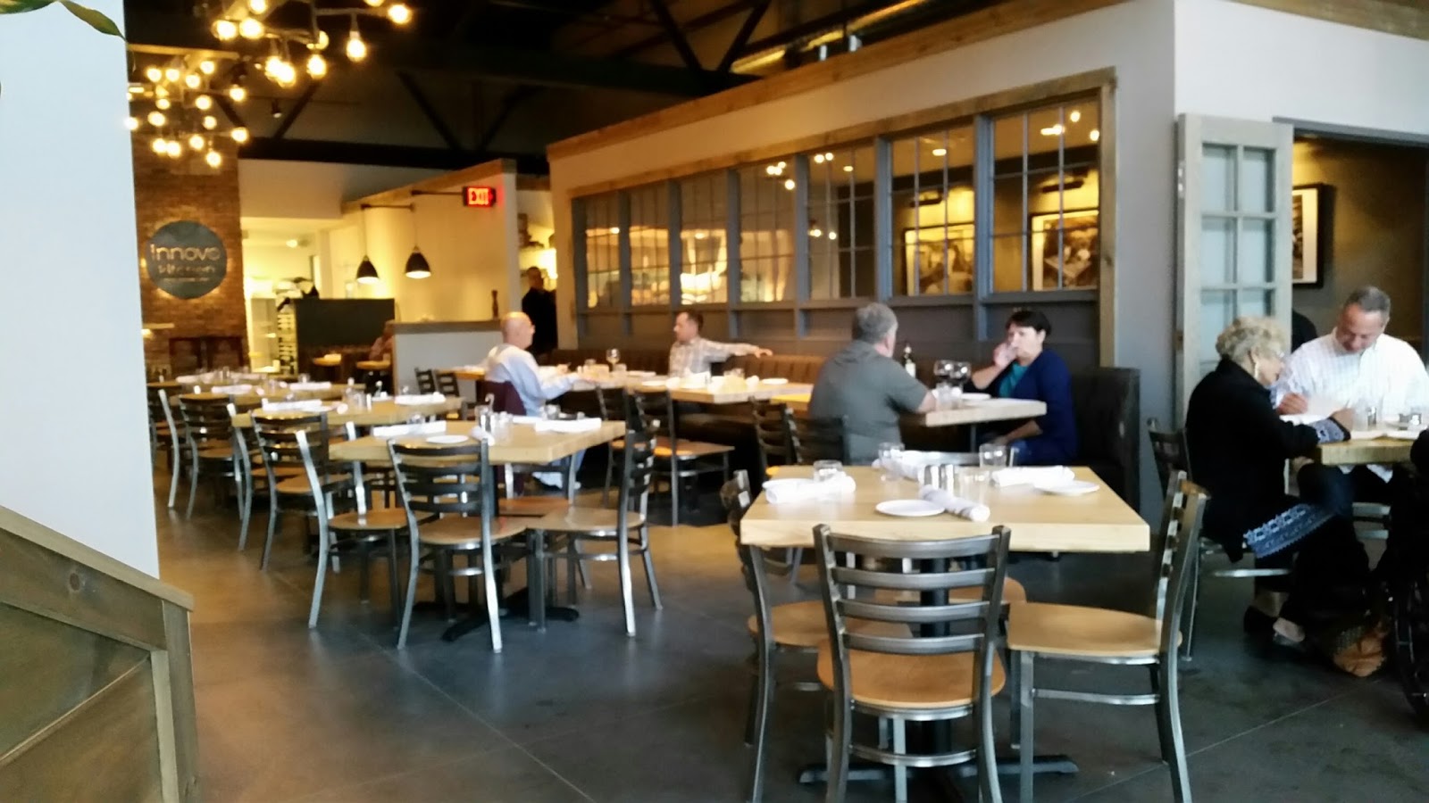 the dining room is attractive but kind of noisy the room with the windows is available for private parties - Innovo Kitchen the dining room is attractive but kind of noisy the room with the windows is available for private parties - Innovo Kitchen