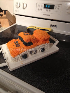 white and orange Nascar birthday cake