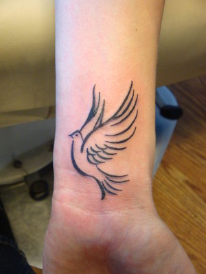 small tattoos of doves. dove tattoos designs.