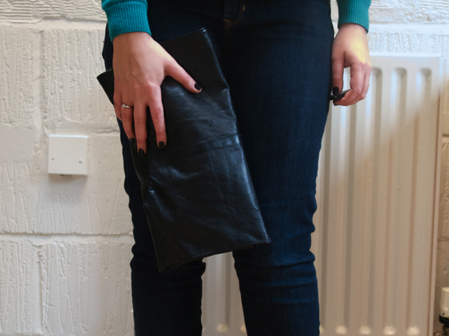 Detail turn a black vintage leather waistcoat into a black DIY clutch bag