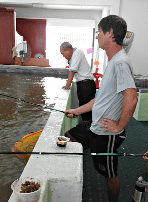 Captain Rod with his rod, indoor pond fishing in Permas Jaya
