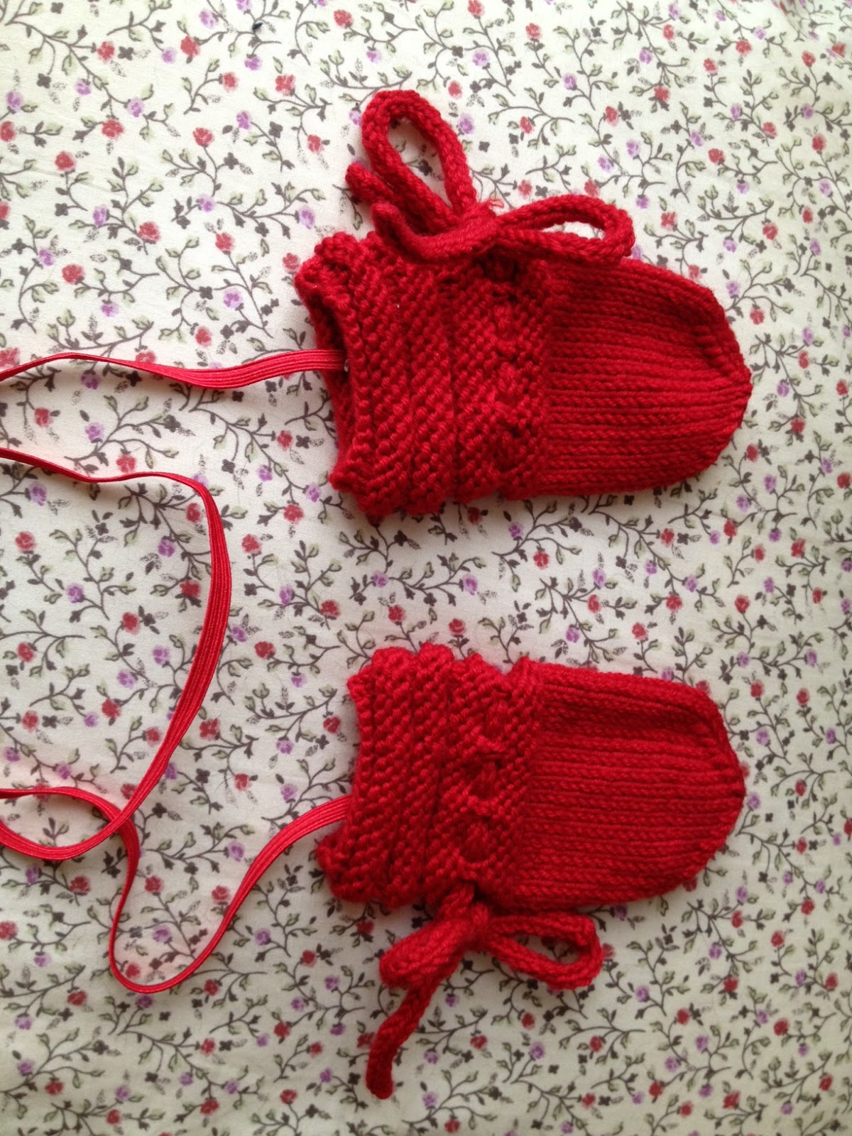 Fraggle Knits and Stitches Baby Madalyn's mittens on a string