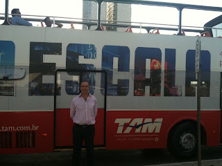 a man standing in front of a bus