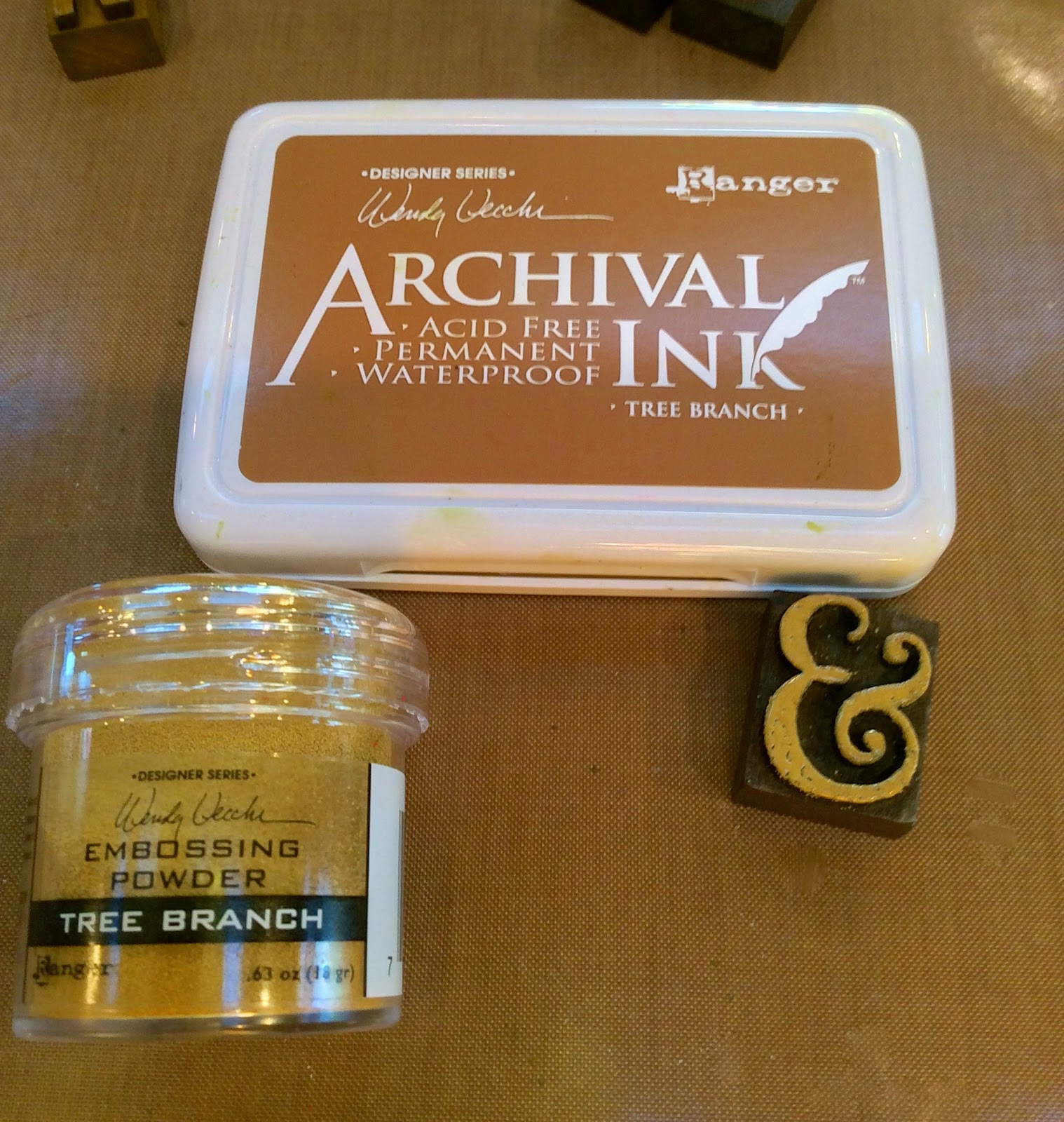 Studio 490 altered with distress spray stain & embossing powders...