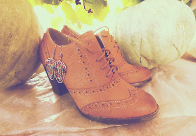 brown shoes and earrings