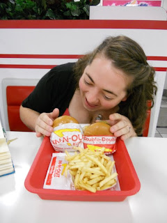 girl eats in and out burger 