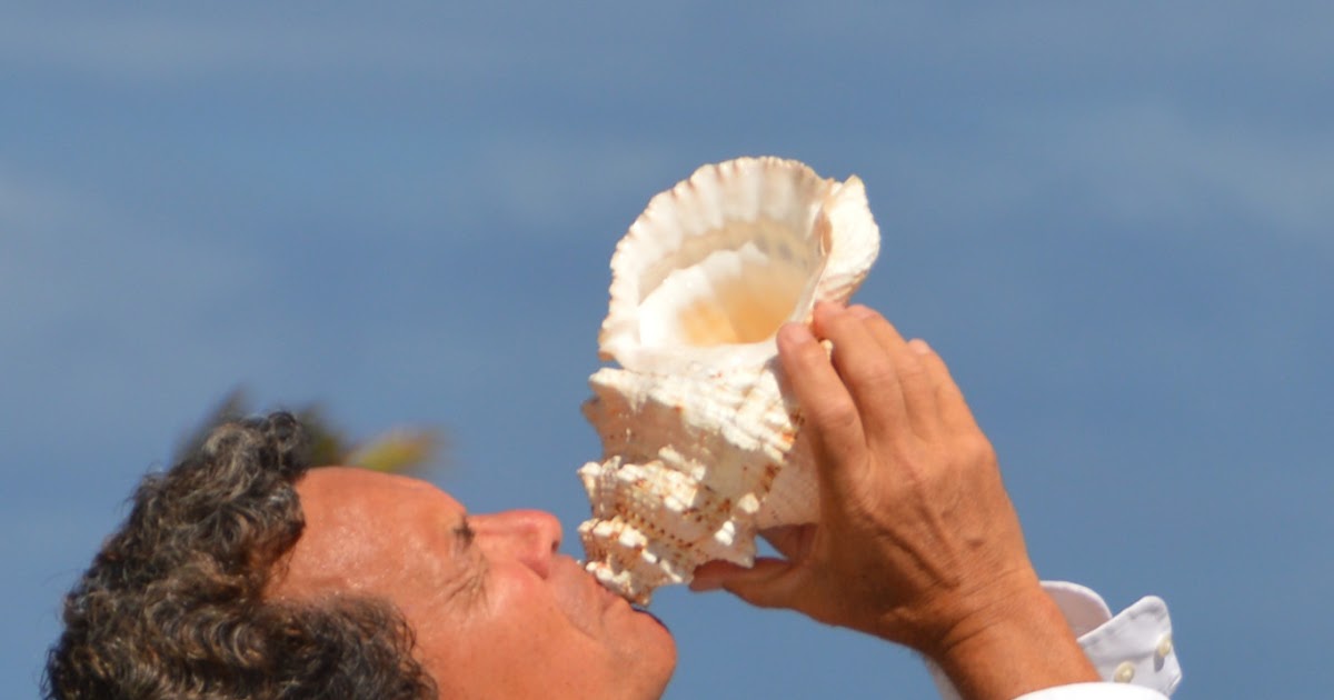 Hawaii Wedding Vendors Blowing the Conch Shell