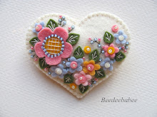 white flowery heart pin