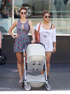 Una Healy and Vanessa White waiting to cross the street