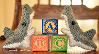 shark booties posed with ABC blocks shark booties with blocks