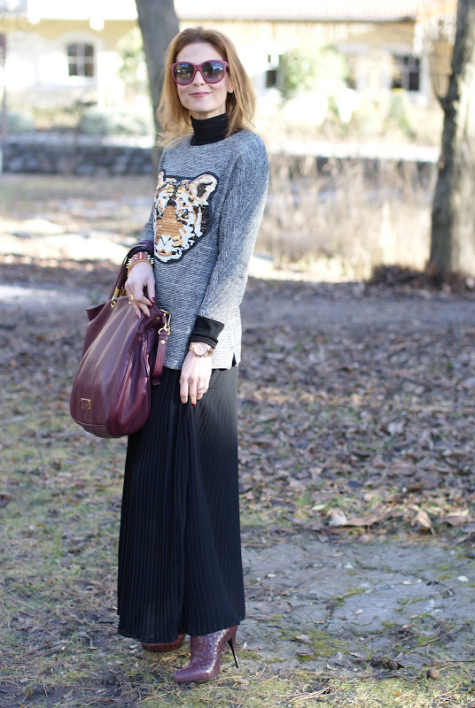 tiger head sweater, black pleated skirt