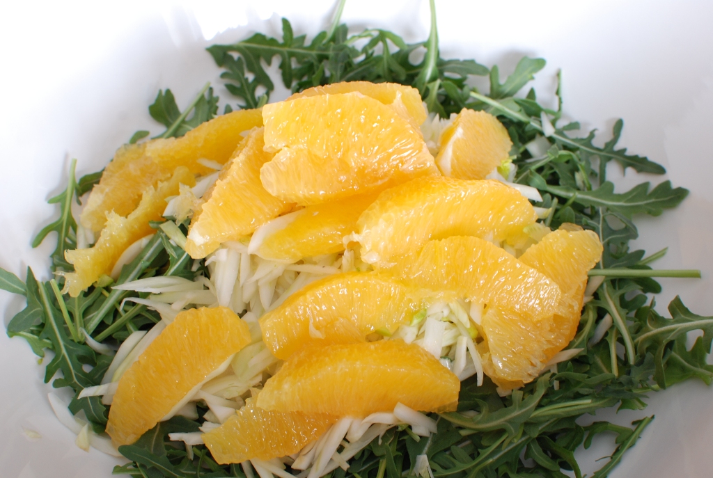 Orange Fennel Arugula Salad with Pomegranates and candied Hazelnuts