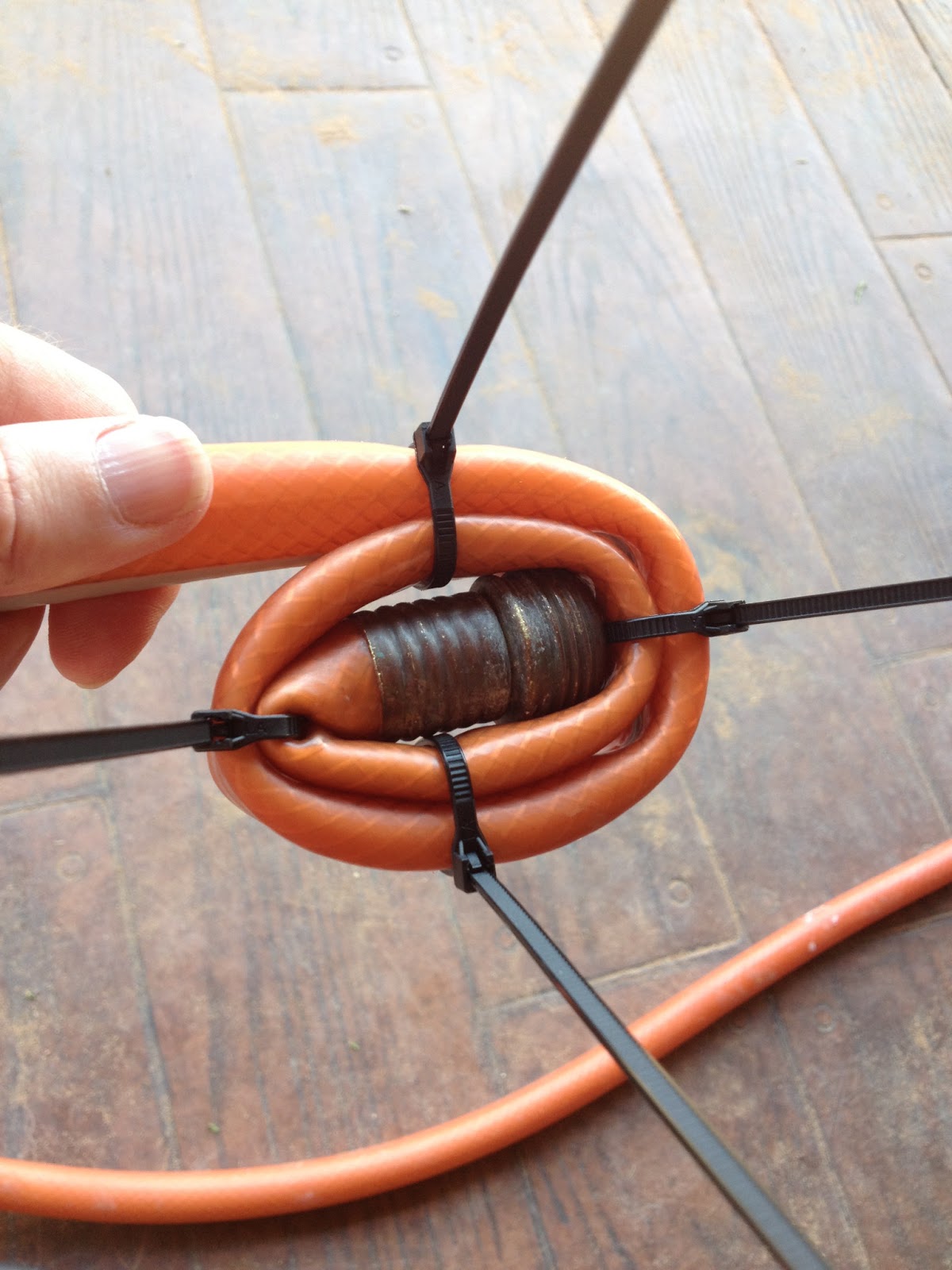 A Building We Shall Go! 1 Old Garden Hose and 201 Zip Ties