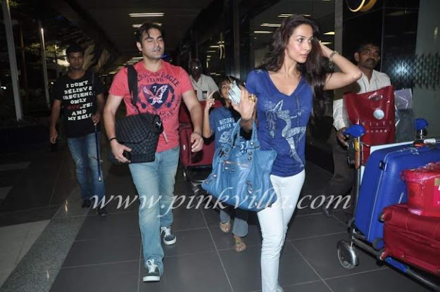 Arbaaz with wife Malaika and son returning at the airport -  Arbaaz, Malaika and son Arhaan Khan  - airport pics