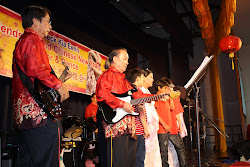 The band accompanying the Mudita Home children singing Chinese New Year songs