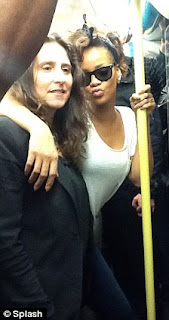 Pictures Of Rihanna riding the London tube with her fans: Damn she couldnt even get a seat. 4 Pictures Of Rihanna riding the London tube with her fans: Damn she couldnt even get a seat. 4