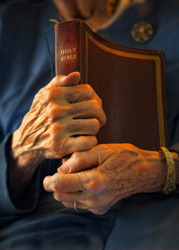 hands on a bible hands on a bible