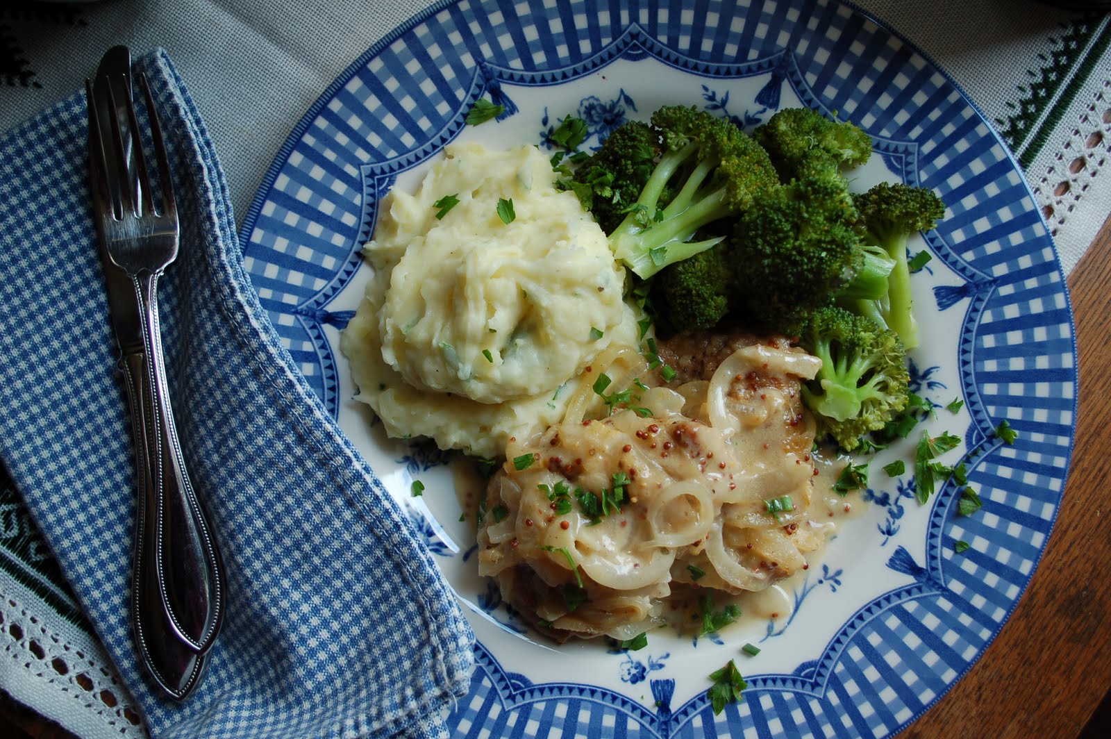 The Spice Garden Pork Scallops Smothered in Onion Mustard Sauce