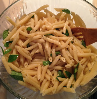 Pasta tossed with coconut oil and basil