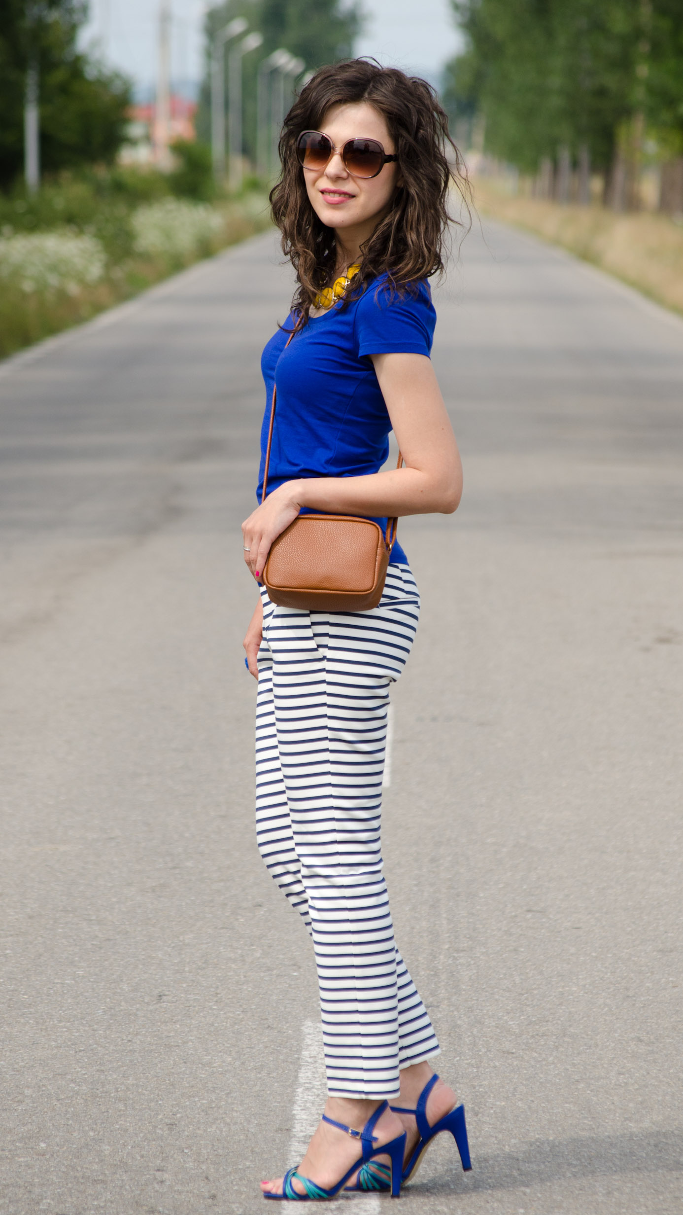 zara navy stripes pants H&M blue t-shirt brown satchel mustard statement necklace poema