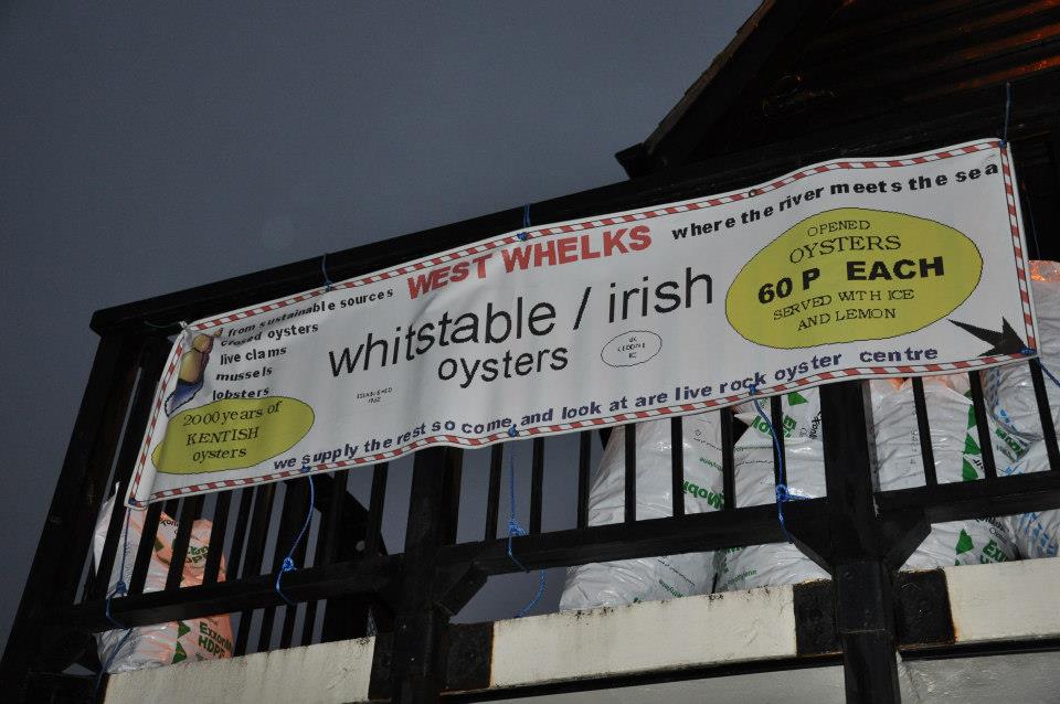 A banner advertising fresh oysters, Whitstable, Kent, UK A banner advertising fresh oysters, Whitstable, Kent, UK