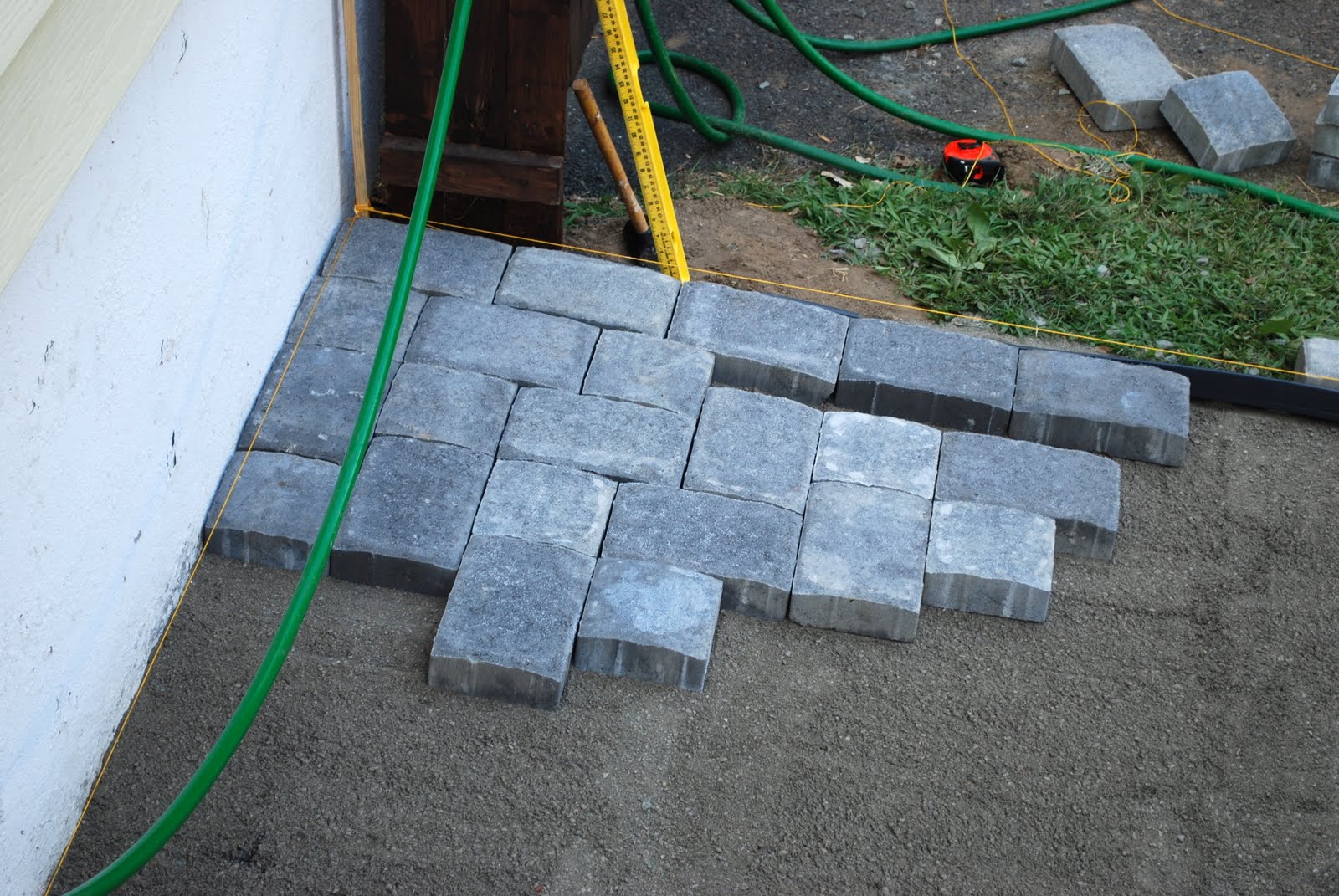 In the Little Yellow House Patio Building Laying Pavers