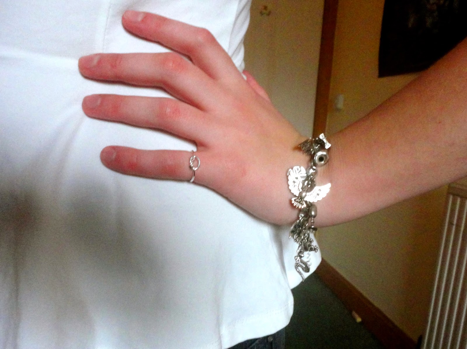 Outfit jewellery details - silver knot ring and Harry Potter charm bracelet