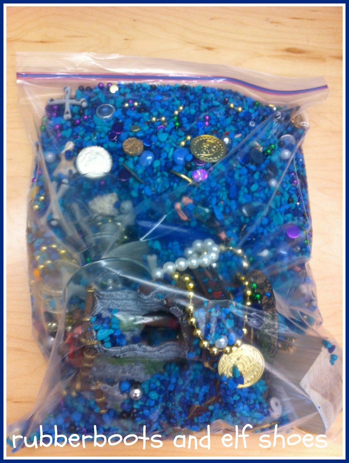 organizing sensory bin "stuff" rubber boots and elf shoes